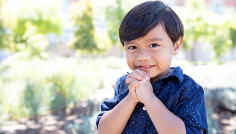 A young boy smiling