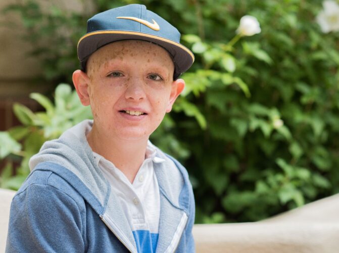 Teenage patient Peter smiles for the camera